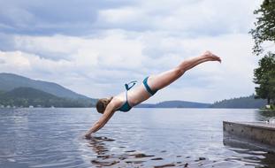 young girl jumping in Water