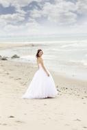 Bride on sand sea