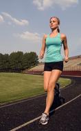 running girl in training at the stadium