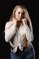 Young blonde Woman in white blouse