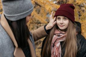 mom with daughter in autumn park