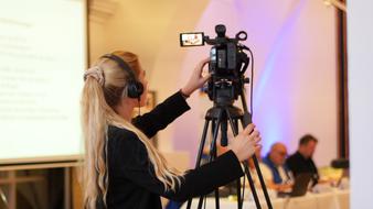 woman filming congress