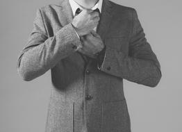 Black and white photo of the man in suit