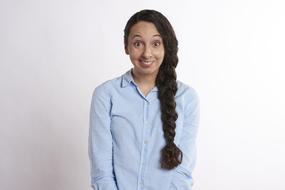 portrait of a happy girl with long hair on a white background