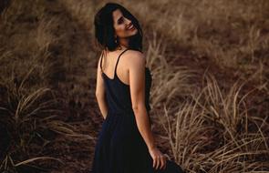 smiling Lady in black dress outdoor