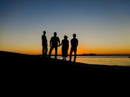 People Silhouettes at Sunset