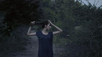 girl with long hair on a gloomy background
