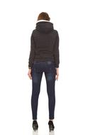 Back view of the woman, in the jacket, at white background