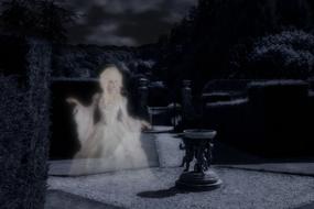 White woman ghost among the dark garden with plants