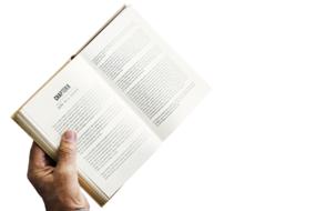 open book in a man's hand