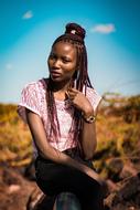 girl with african braids against the blue sky