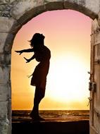 female silhouette at sea, view through doorway, collage
