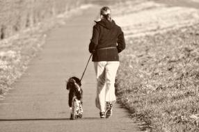 woman with dog jogging in monochrome