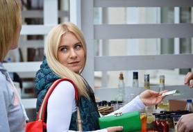 blonde girl Paying Cash