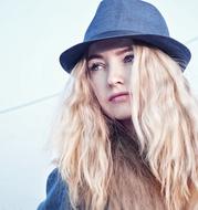 girl with white hair in a hat