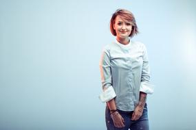 studio portrait of a woman in white blouse