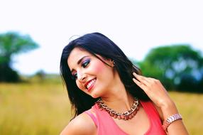 happy model with makeup on the field