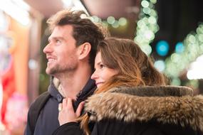 couple in love is looking at a shop window