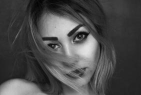 Black and white photo with the portrait of the woman with make-up