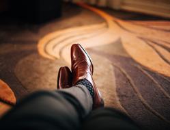 mens feet in brown classic shoes