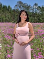 pregnant woman in pink dress