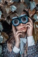 woman in unusual glasses among the foliage