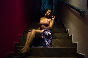 Beautiful girl, posing for the advertising, on the stairs, in light
