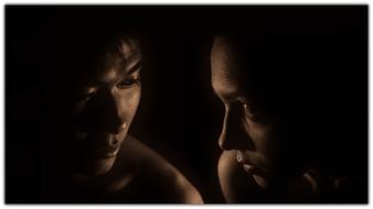 portrait of couple in darkness