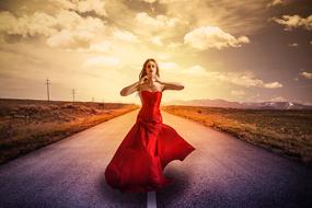 Woman Walking on road in countryside