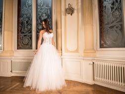 girl in sparkling wedding dress posing