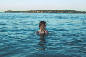 Woman Swimming in Water at Summer