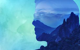 woman in the mountains as double exposure