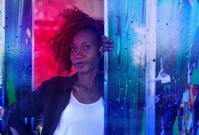 cool young african Woman in colorful light