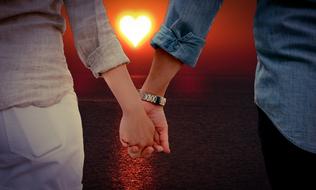 couple in Love Together hand in hand at sunset