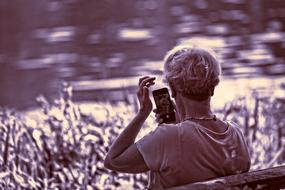 woman looking into smartphone