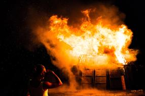 burning wooden barn