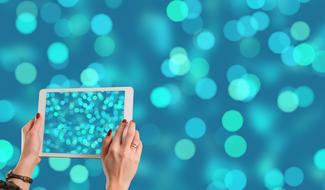 clipart of tablet in woman hands at blur bokeh