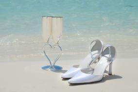 bridal shoes and wedding glasses