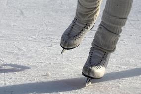 Woman, doing figure skating, with the skates, on the snow, in the winter