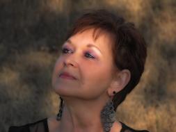 Portrait of the woman with earrings and short hair