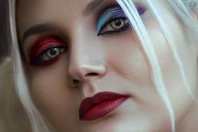 blonde with colorful makeup close up