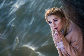 portrait of a scared girl by the sea