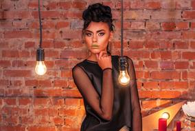 model with green lips at a photo shoot