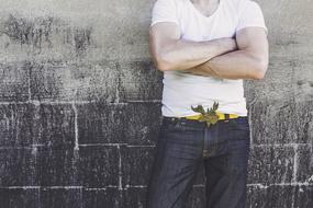 photo of a young man in a white t-shirt and jeans