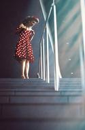 woman in pin-up style on stairs
