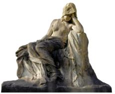 statue of a woman sitting on a stone