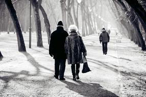 Black and white photo of the walking couple