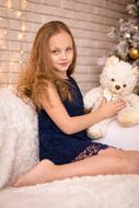 girl with a polar bear on the bed