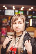 girl with headphones in the store