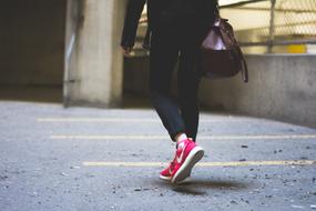 girl feet in pink sneakers